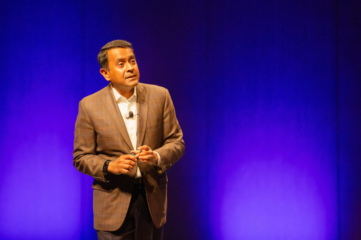 Ravin Jesuthasan on stage at AHRI's Convention